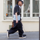 Are these fashion week attendees off to the laundromat? Who knows! / Image via Getty